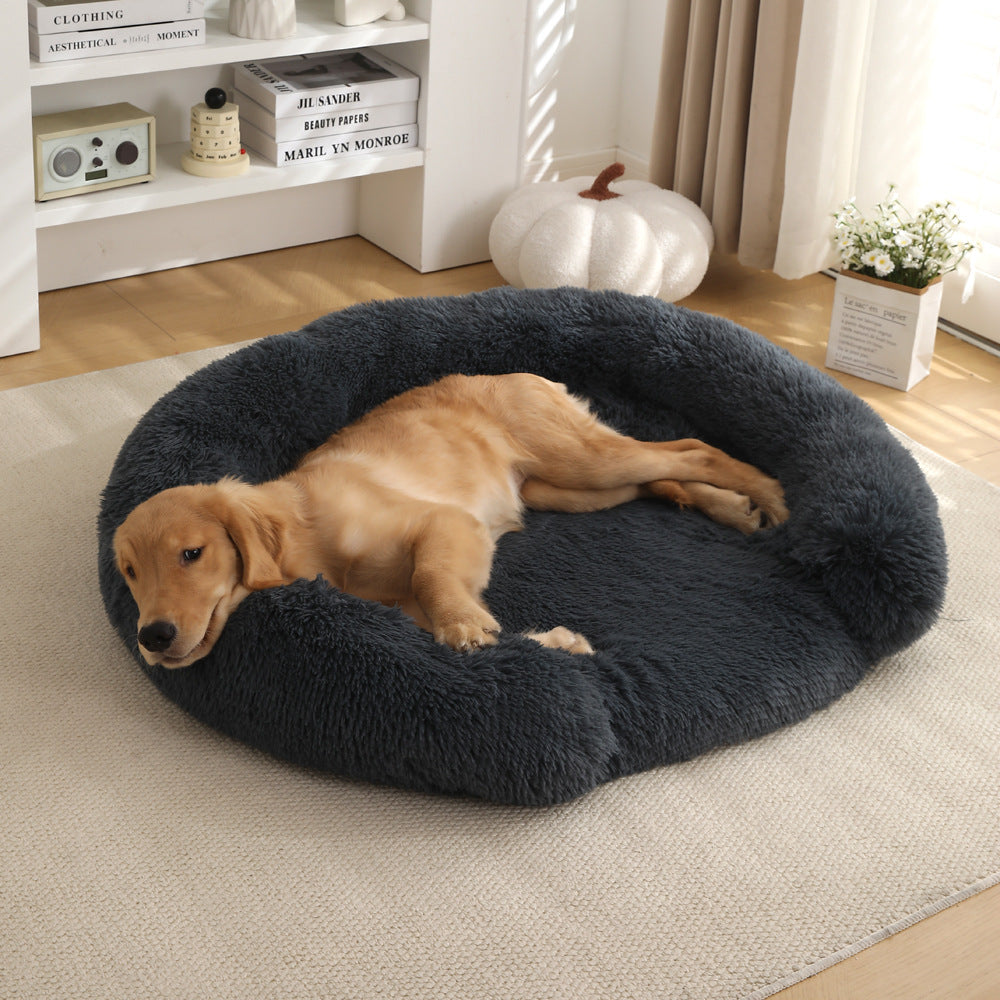 Golden retriever resting in a dark gray Kodi & Co. plush round dog bed with raised walls on a living room rug.